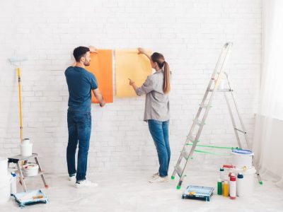 young-happy-couple-choosing-in-what-color-painting-their-new-house.jpg